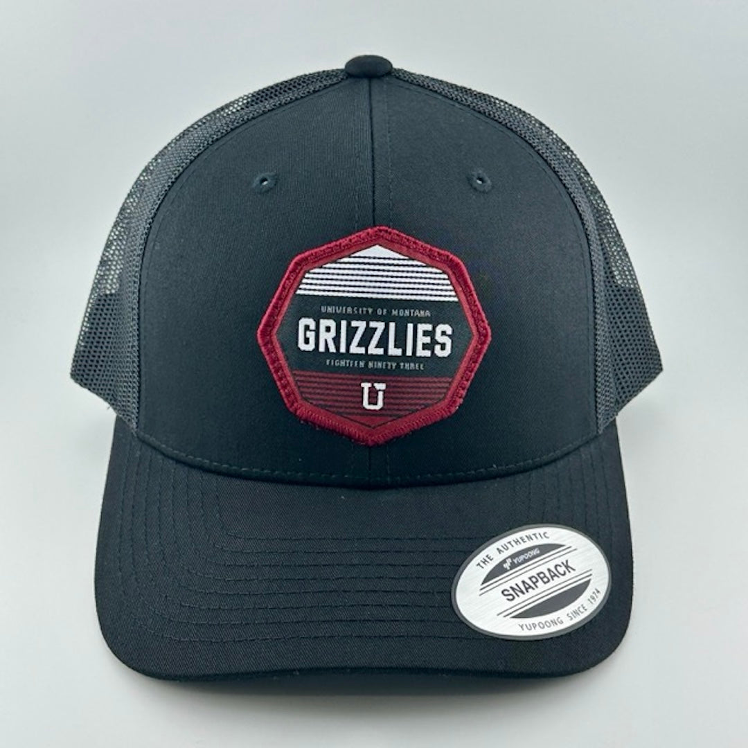 Baseball cap with black face, black brim & plastic mesh back. Maroon, white & black Montana Grizzlies logo center-face.