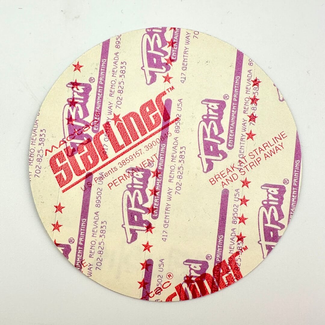Backside of sticker to show intact backing and pristine condition.