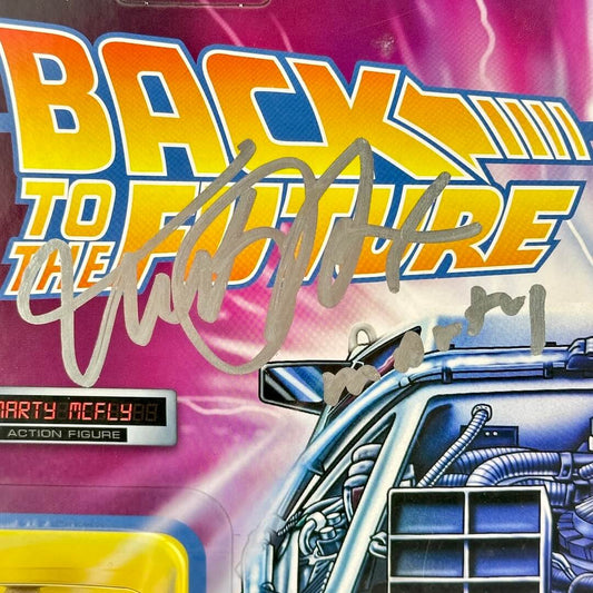 Back to the Future action figure packaging with DeLorean and signature