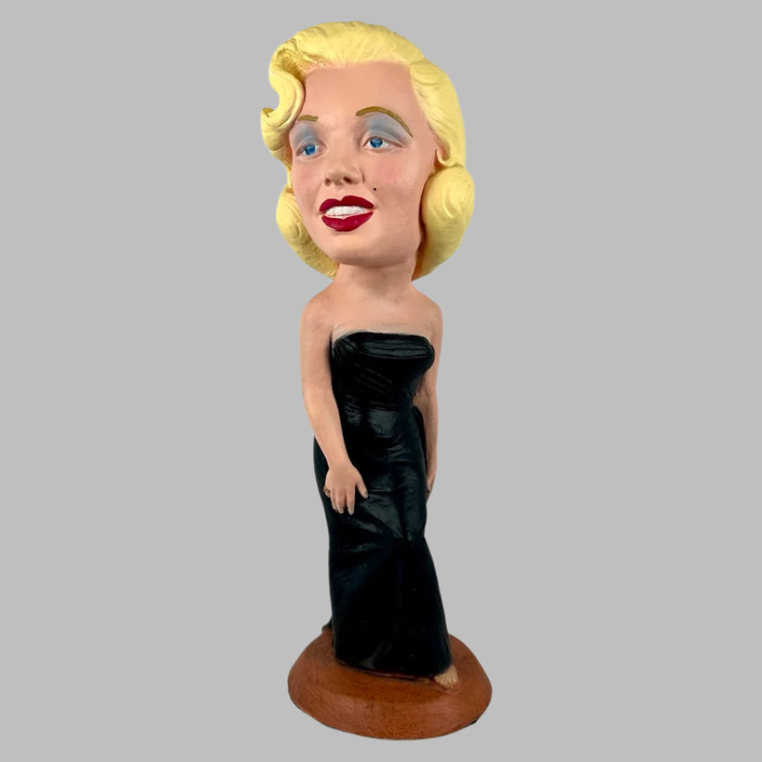 Chalkware figure of Marilyn Monroe in sleeveless long black dress, with red lipstick & blue eyeshadow.