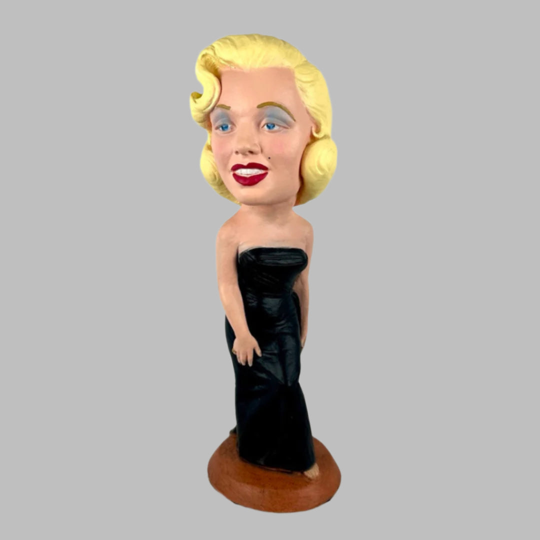 Chalkware figure of Marilyn Monroe in sleeveless long black dress, with red lipstick & blue eyeshadow.
