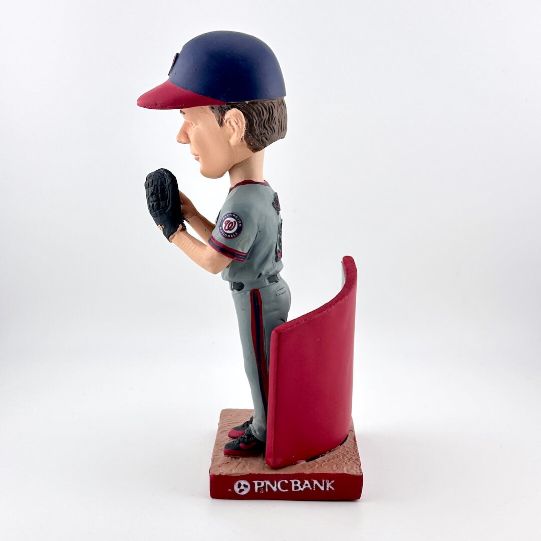 Baseball bobblehead figure with a red and gray uniform on a white background