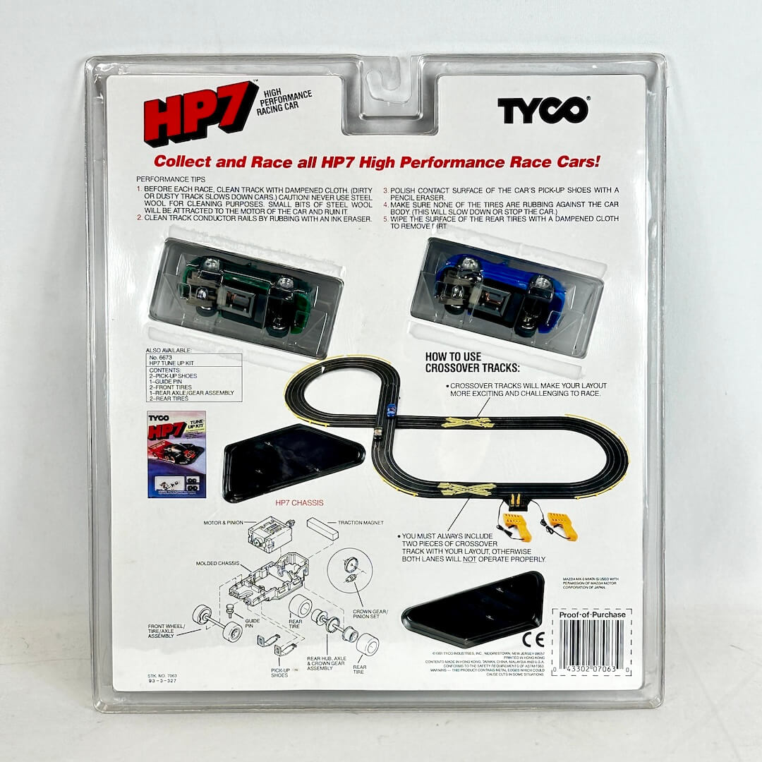 Tyco HP7 high-performance race car set packaging with instructions and graphics.