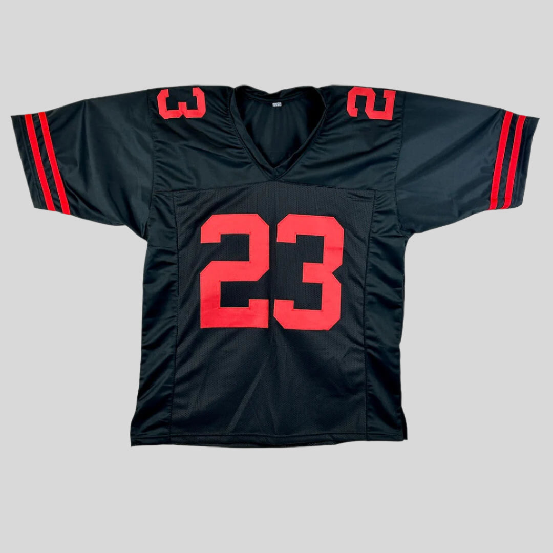 Black sports jersey with red numbers on a gray background