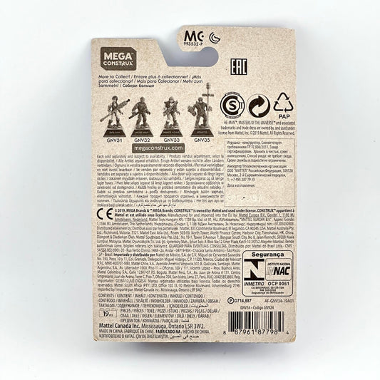 Backside of mini Skeletor action figure with product and manufacturer information in small print on light background.