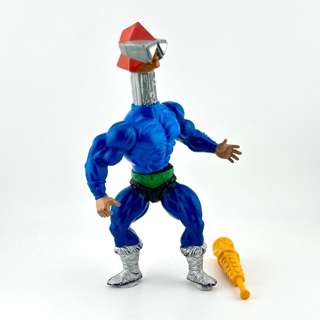 Blue muscular figure with extended silver neck. silver boots, silver glasses and an orange hat. Wearing green belt.