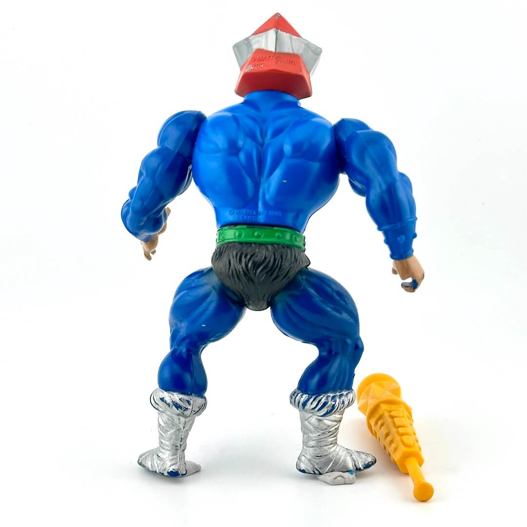 Blue muscular figure back with extended silver neck. silver boots, silver glasses and an orange hat. Wearing green belt.