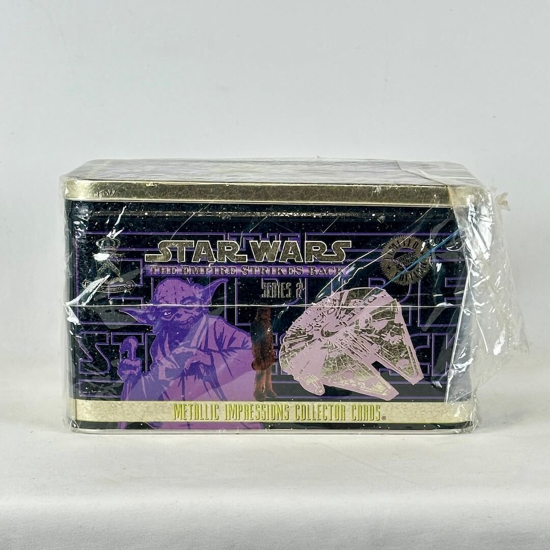 Star Wars trading card pack with Yoda and Millennium Falcon design on a white background