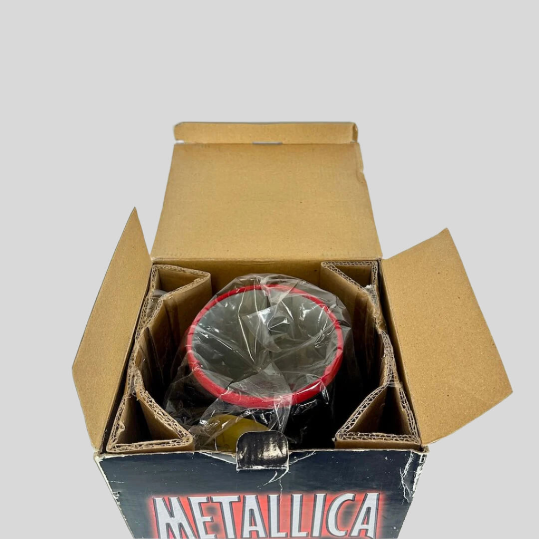 Metallica branded box with a metal shade inside on a white background