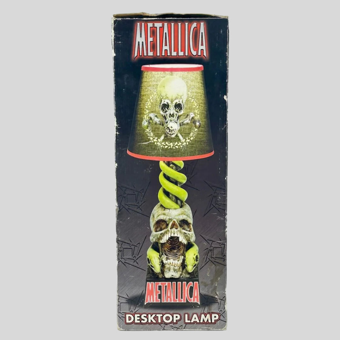 Metallica desktop lamp packaging with skull and snake design on a white background