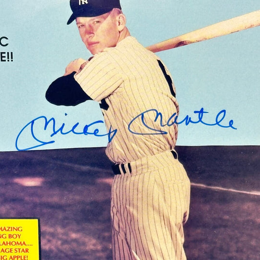 Close-up of signature across center of cover on top of image of player.