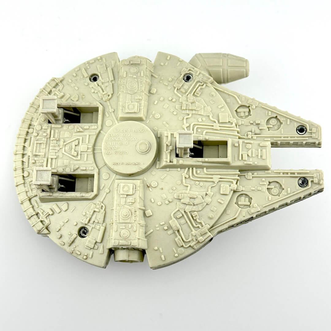 Diecast model of a spaceship of the Millennium Falcon on a white background