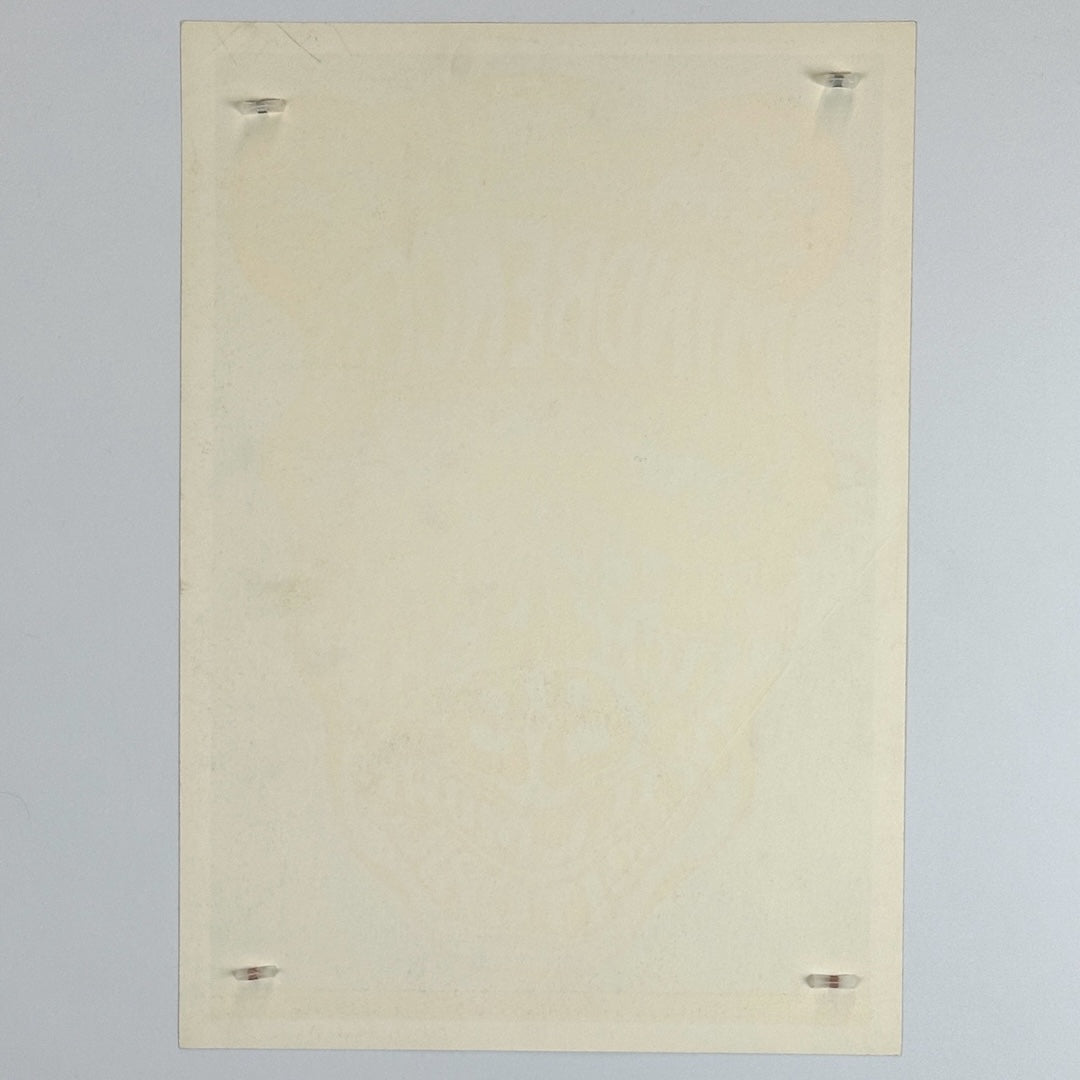 Backside of white poster showing no smudges but slight aging.