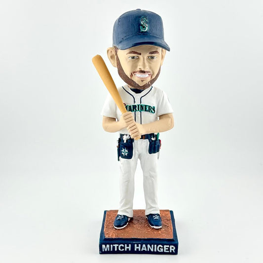 Bobblehead of a baseball player in uniform with a bat on a white background