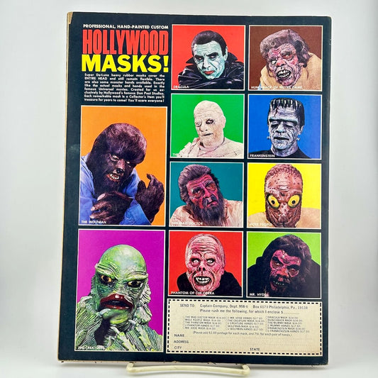 Vintage Halloween costume ad for 'Hollywood Masks!' with a grid of colorful horror masks on the back cover of magazine.