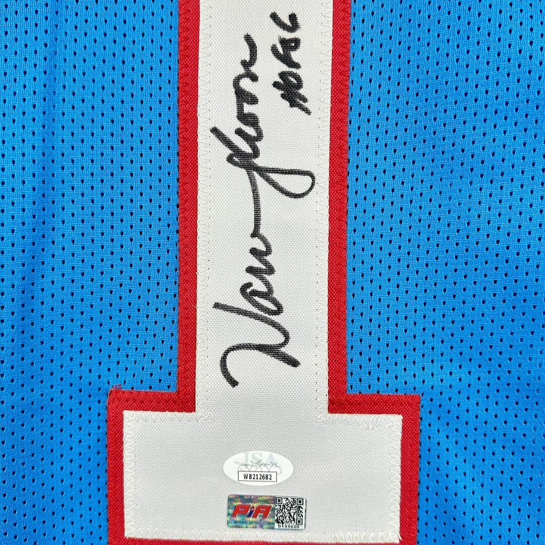 Close-up of a sports jersey with a signature and brand logo on a blue background
