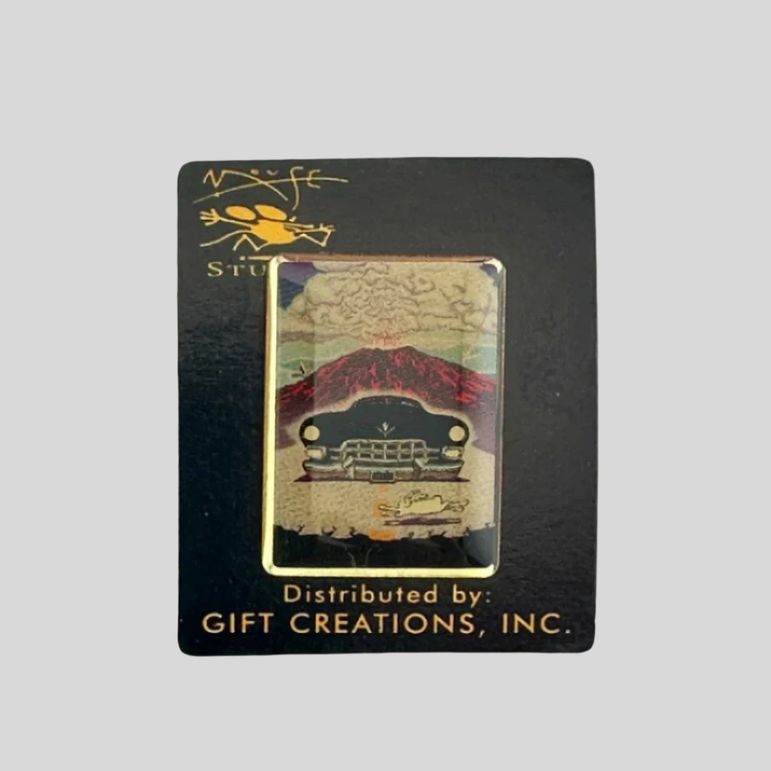 Hard enamel pin of black cadillac driving away from exploding volcano, nearly hitting a white rabbit in front.