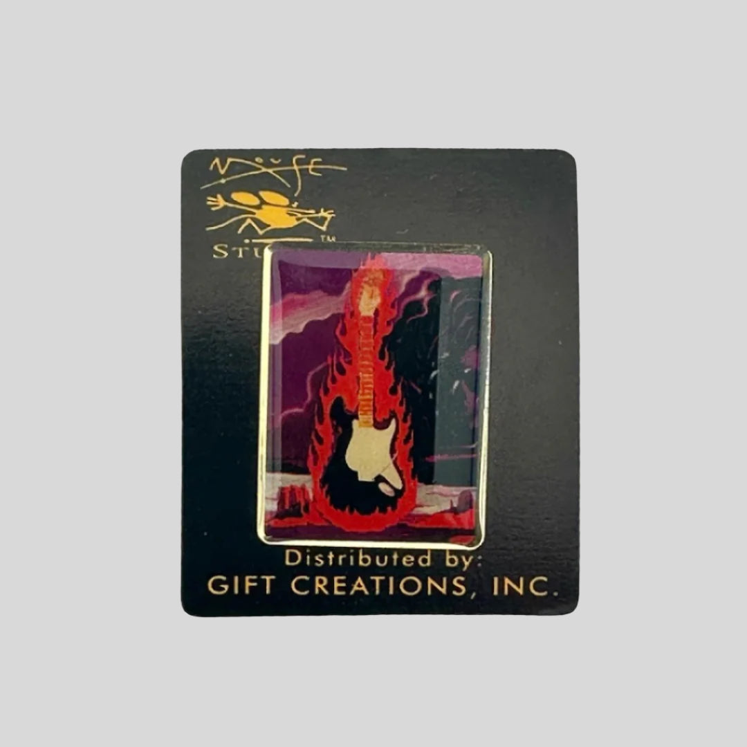 Hard enamel pin with flaming guitar in center with purple cloud background.