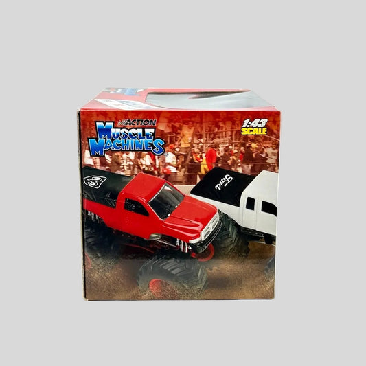 Boxed toy truck with 'Muscle Machines' branding on a white background