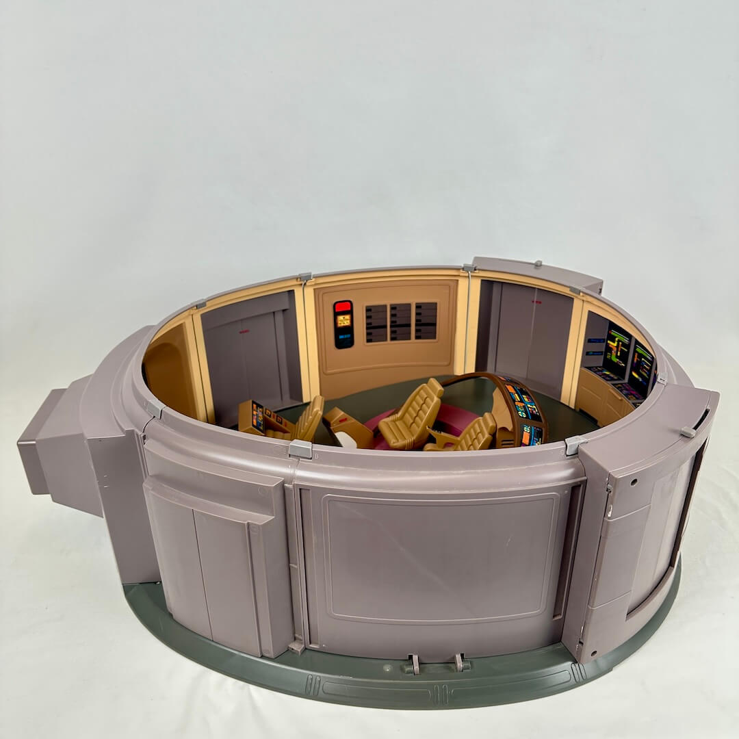 Model of a circular spacecraft interior with detailed panels and seats on a white background