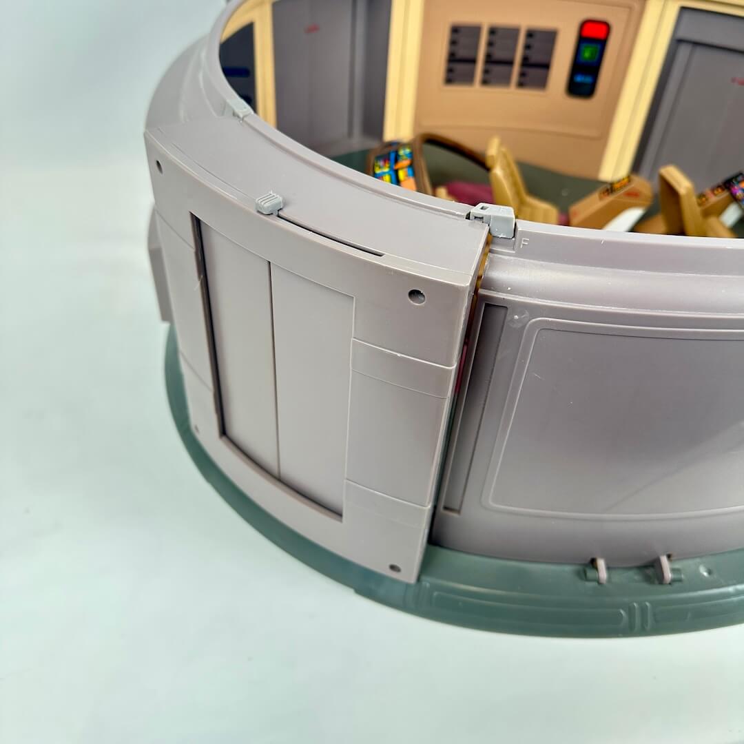 Model of a spacecraft interior with detailed control panel and seats on a white background