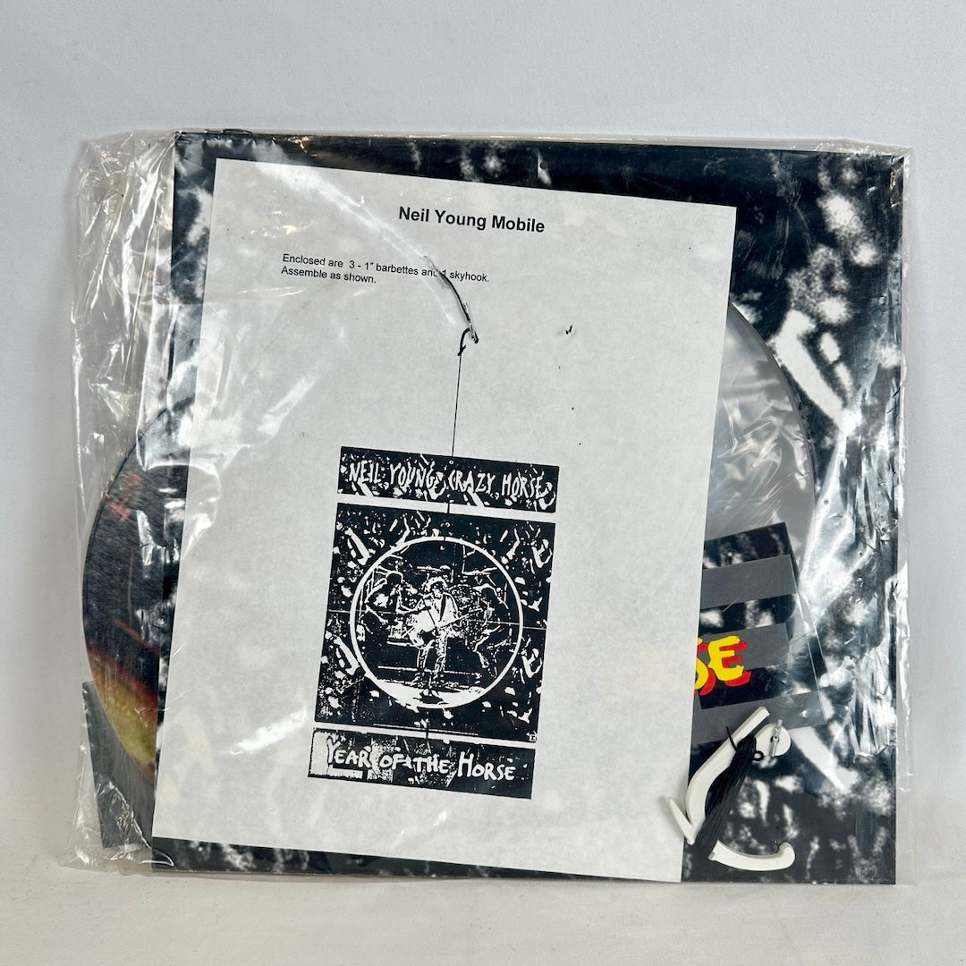 Plastic bag containing mobile and all its parts, with instructions sheet printed.