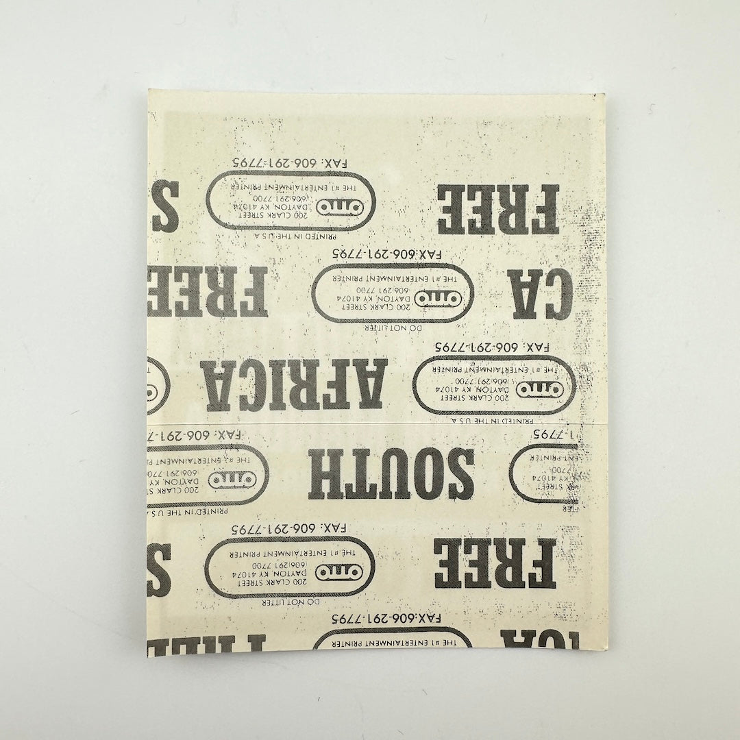 Backside of pass showing intact paper backing and mint condition.