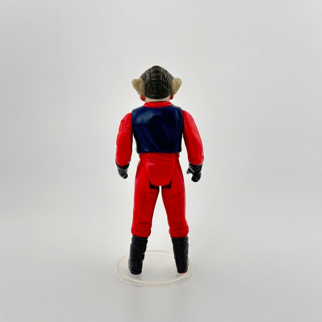 Image of 3-inch alien figure with grey wrinkled skin & pink mouth in a red flight suit, navy vest, black boots and gloves.