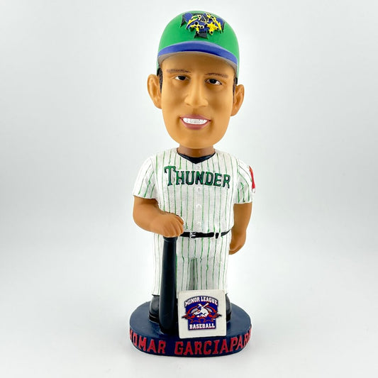 Bobblehead figure of a baseball player in a green and white striped uniform with 'Thunder' on the jersey, holding a bat.