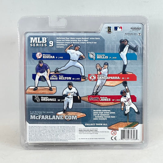 Packaged MLB action figures with player cards on a white background