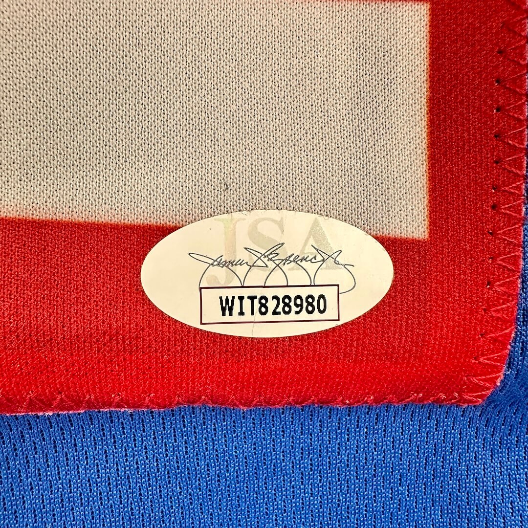 Close-up of a label on a piece of fabric with red, white, and blue colors.