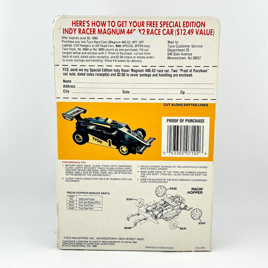 Back of a toy race car packaging with text and graphics on a white background