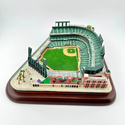 Model of a baseball stadium on a wooden base with a white background