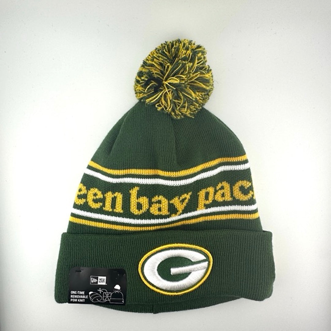 Green knit cap with white/yellow stripes around yellow team name, Packers logo in center of green cuff & green/yellow pom