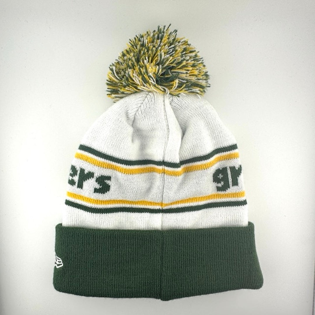 White knit cap with green/yellow stripes around green team name, Packer logo in center of green cuff & green/yellow/white pom
