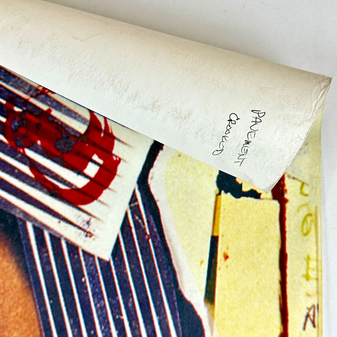 Top right corner rolled down to show note in pen on reverse side.