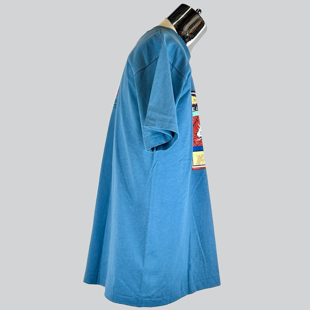 Side view of a rare, unworn 1995 blue Pearl Jam tour t-shirt from the Missoula, MT concert, facing right.