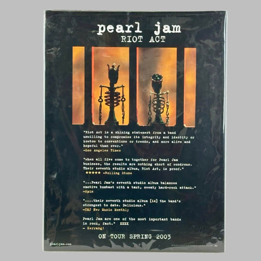 Black poster with two small skeleton chess pieces in barred window above typed reviews for the Riot Act album.