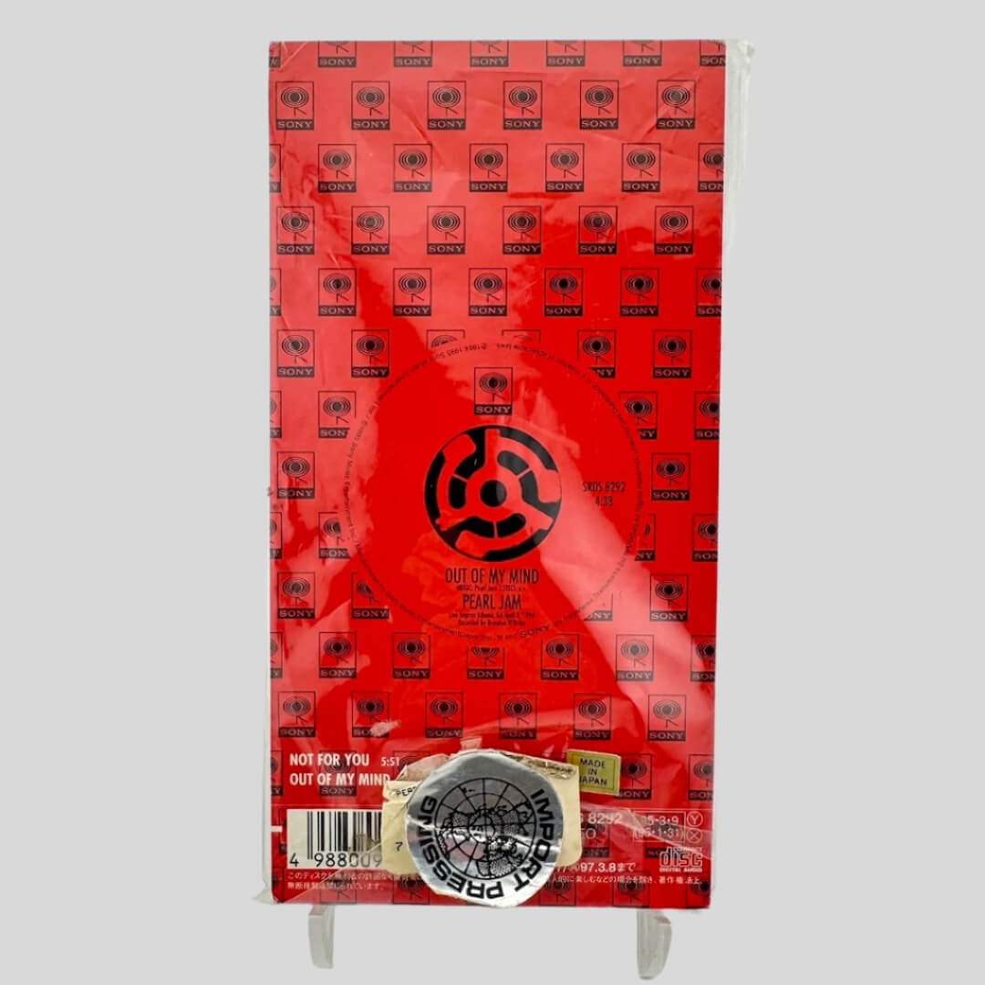 Red packaging with black text & symbols. White text for main title & artist information in Japanese & English.