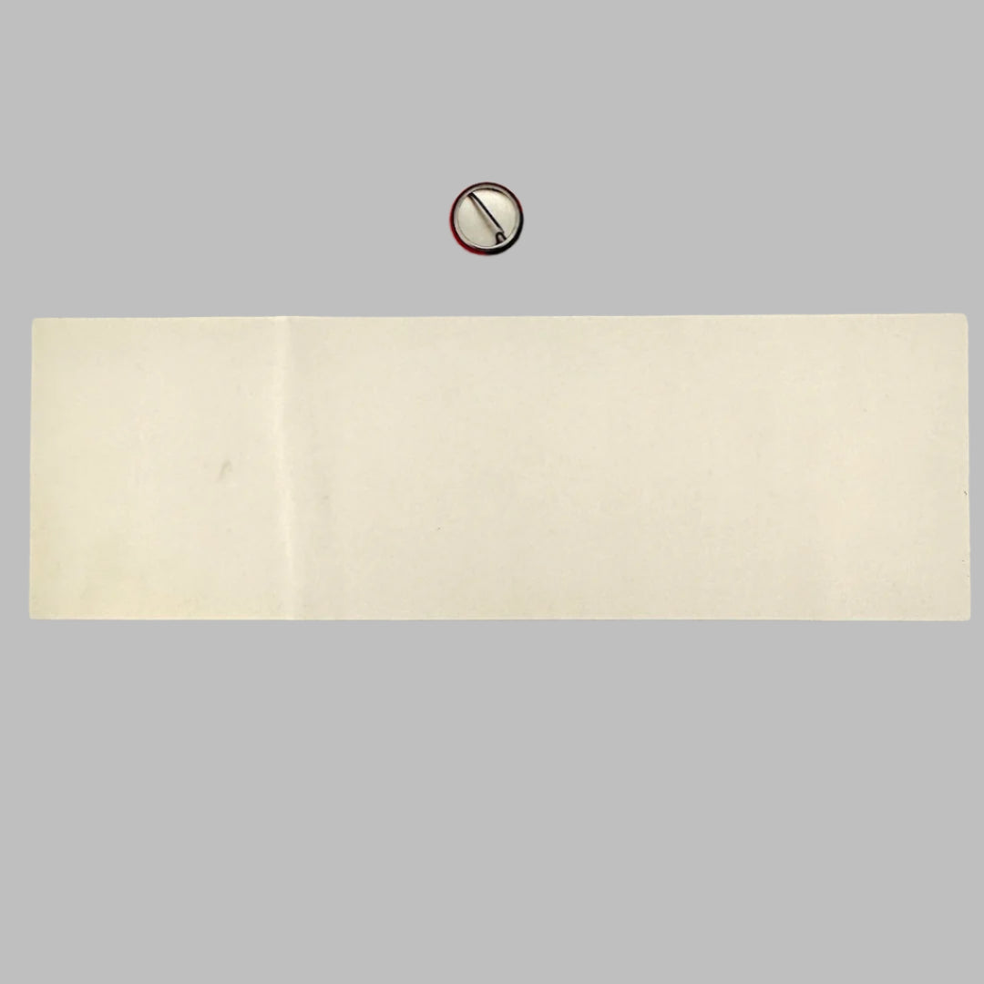 Reverse side of unused sticker showing no damage, nor to reverse side of pin.