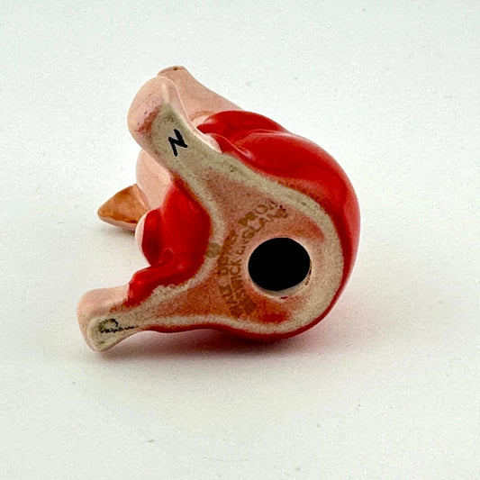 Underside view of pig figurine with 'Walt Disney' branding and 'Beswick England' maker's mark.