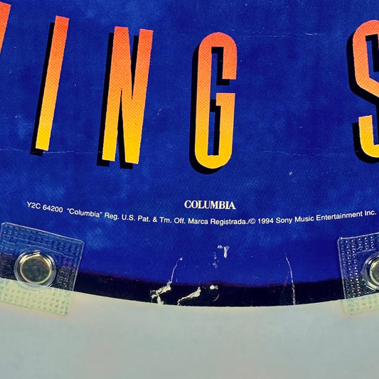 Close up of copyright info at bottom center of poster, pin holes visible.