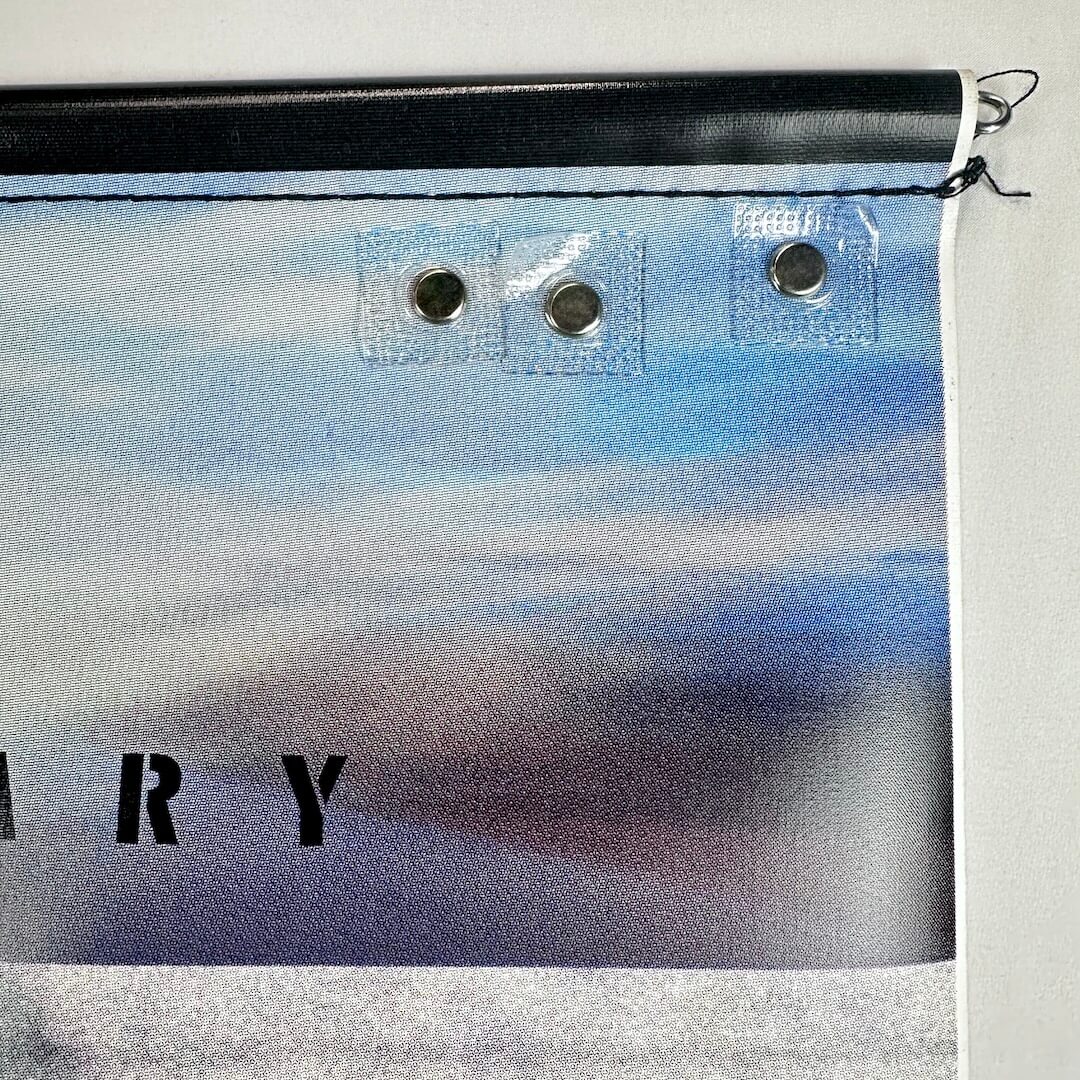 Top right corner of banner