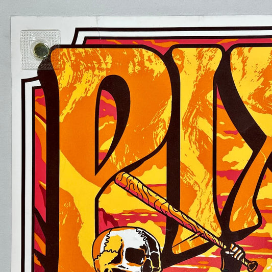 Colorful graphic design with abstract shapes and a skull on a yellow background