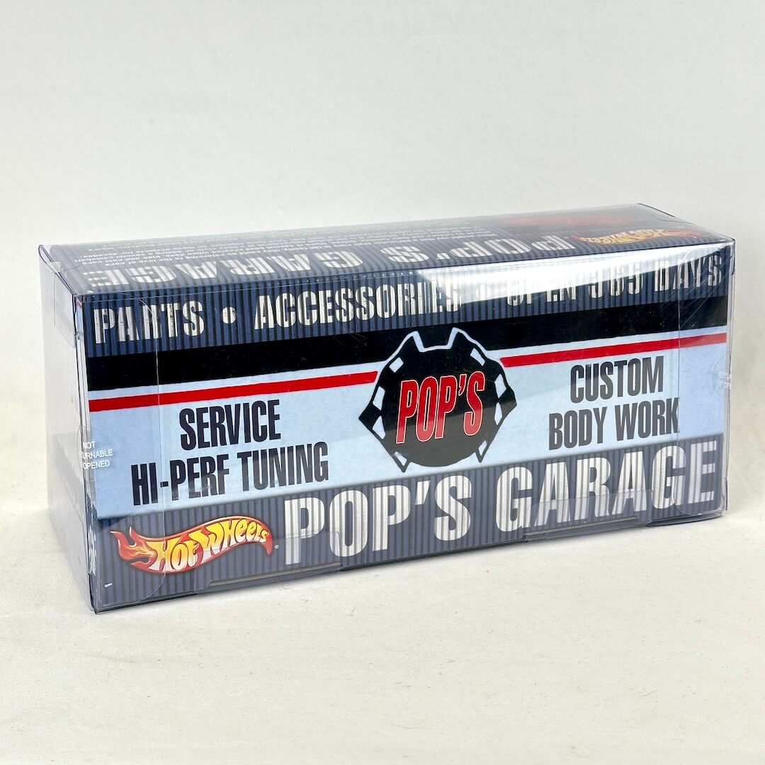 A boxed set of Hot Wheels cars, featuring a blue, white, and red design with 'Pop's Garage' and the Hot Wheels logo.