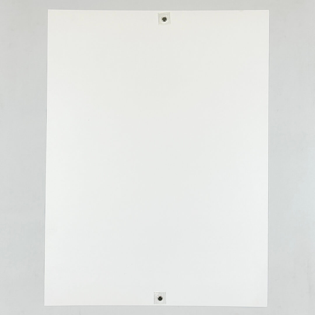 Backside of white poster showing no damage and pristine nature.