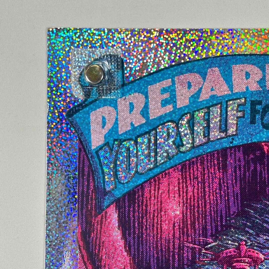 Top left corner of poster showing no damage to face, corner or edges.