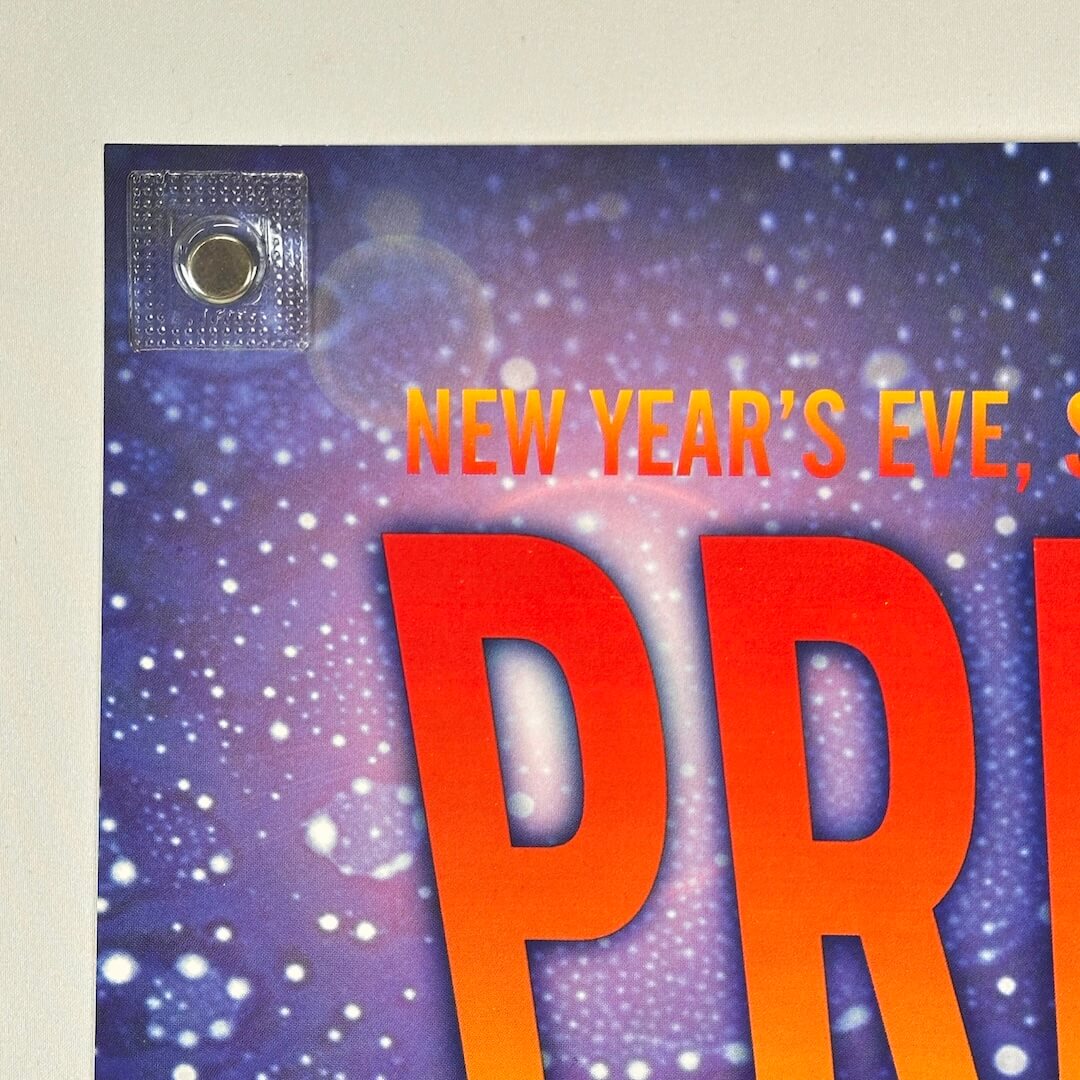 Top left corner of poster to show clean edges and crisp corner. Beginning of event date & headliner visible.