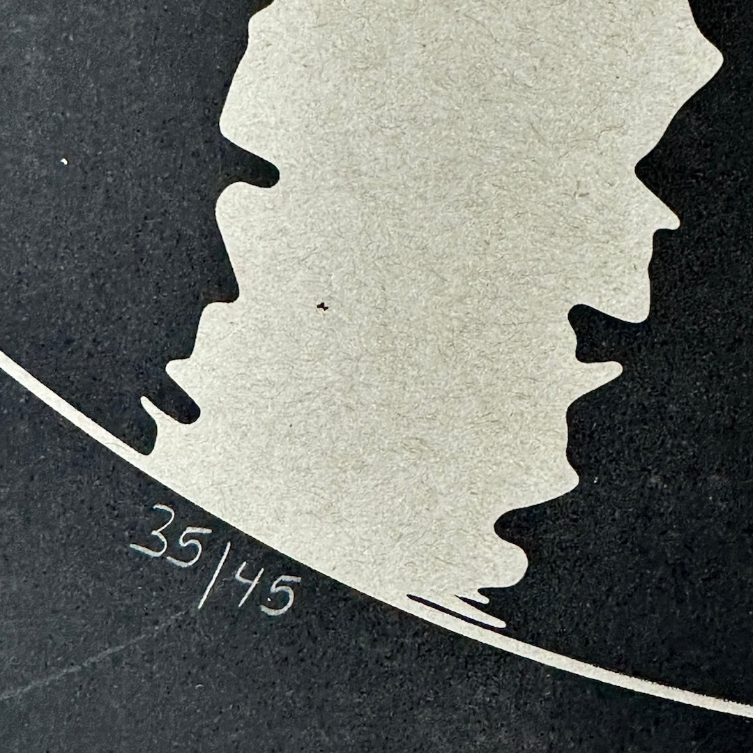 black poster with pencil marking 35/45 for number of posters made.