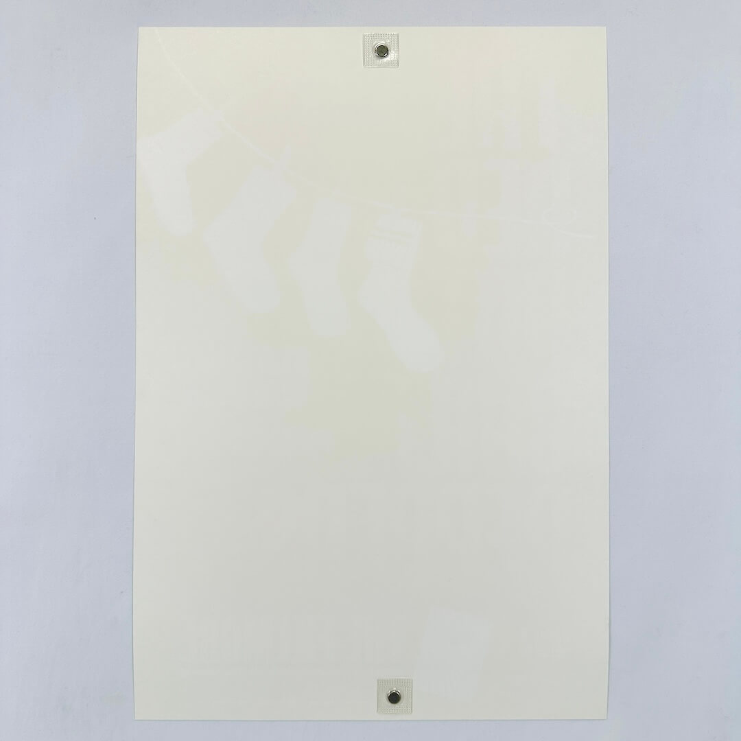 Backside of white poster showing zero damage and pristine condition, against white background.